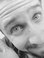 Close-up of a person's face with a blurred background